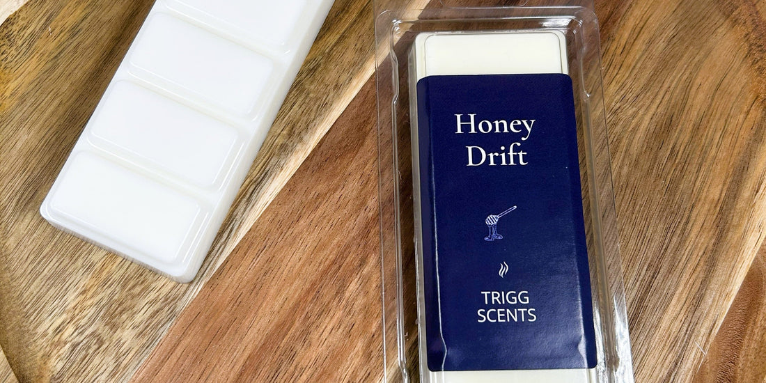 Honey Drift honey and tobacco wax melt snap bar by Trigg Scents on wooden surface
