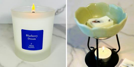 Candle and wax melt burner side by side on marble surface showing comparison between home fragrance options.