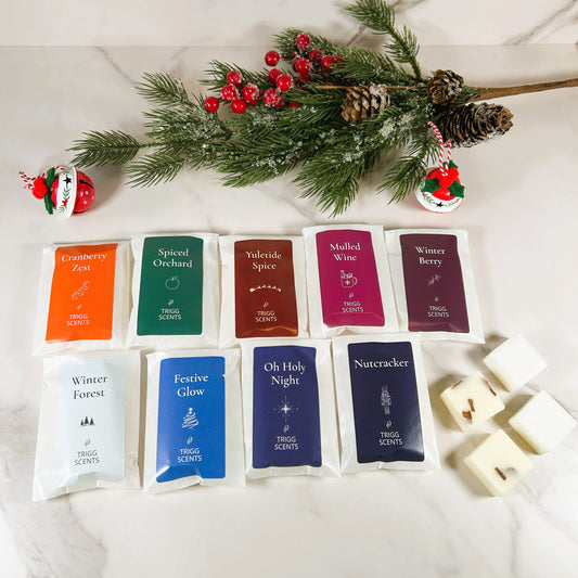 TRIGG SCENTS 9 Christmas luxury wax melt selection gift set with festive fragrances Cranberry Zest, Yuletide Spice, and Winter Forest.