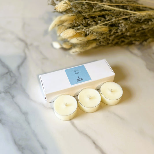 TRIGG SCENTS Linen Air 3 pack tealights in a white box – fresh clean fragrance inspired by crisp linen and soft morning air.