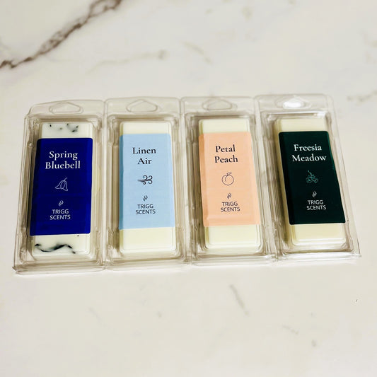 Spring Home Reset Wax Melt Set with four soy mineral blend scents including Spring Bluebell, Linen Air, Petal Peach and Freesia Meadow.